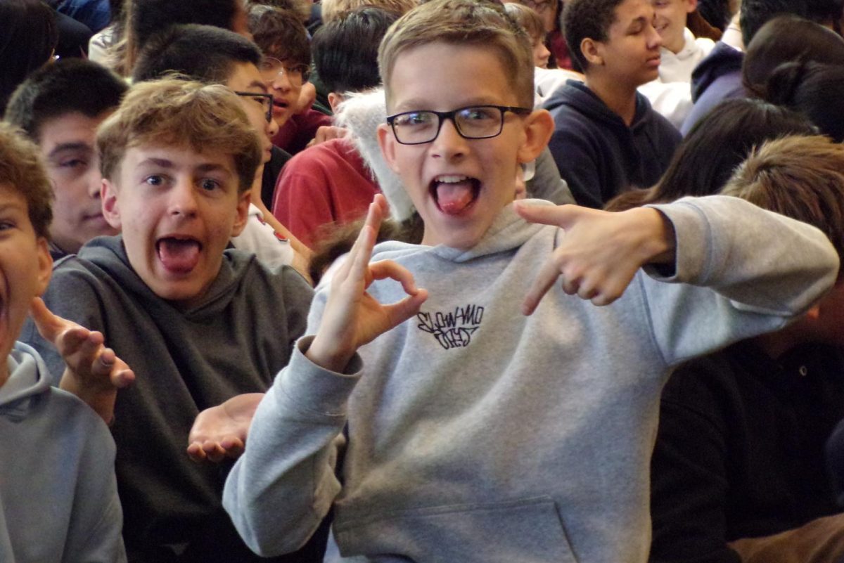3, 4, 5, 6-7! 
Andrew Nesterov and David Kovachyk strike a 6-7 pose while waiting for the October High Honors assembly to start. Many people hop onto this trend sooner or later, and will celebrate it whenever given a chance. Looking back, Andrew has no regrets, justifying his position with, “I thought it would be funny.” 
